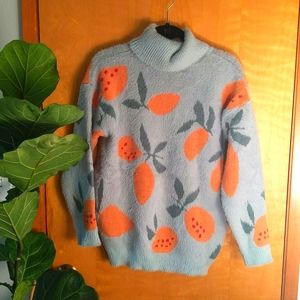 Orange print turtleneck sweater